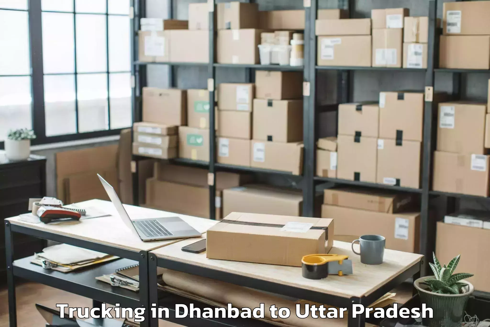 Book Dhanbad to Uttar Pradesh University Of Me Trucking Online